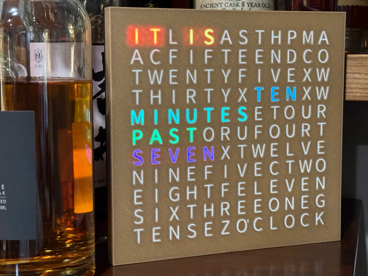 The current build — white letters diffuse the light evenly, every word in its own color