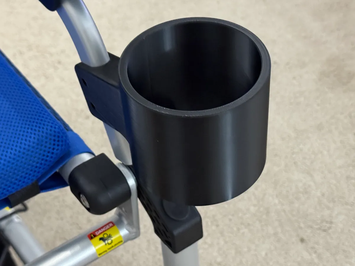 Bolted to the chair’s own controller mounting points — no clamps, no round bar required